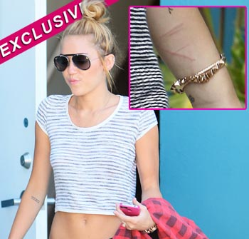 //miley cyrus cutting exclusive