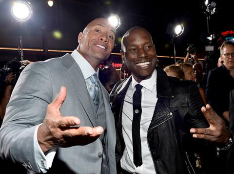Tyrese Gibson and Dwayne Johnson pose for a photo.