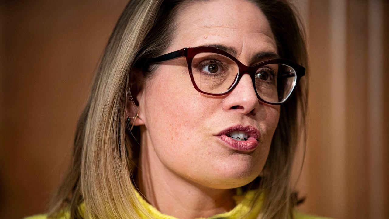 image of Kyrsten Sinema revealed she and Matthew Ammel had a secret encounter at CNN host Jessica Dean's 2024 wedding.