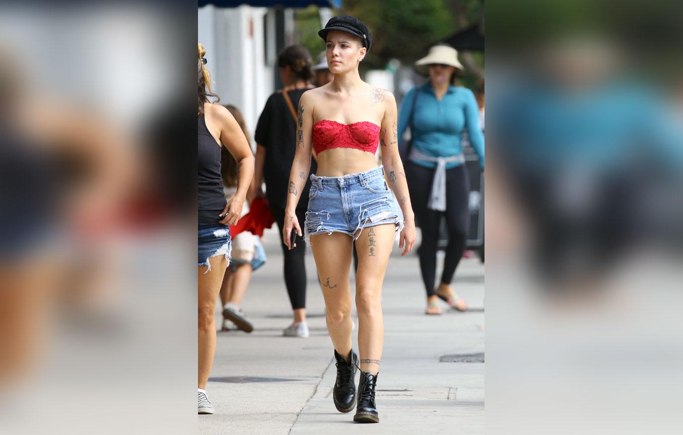 //halsey spotted wearing lace bra and daisy dukes