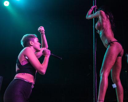 //miley cyrus on stage revealing outfit