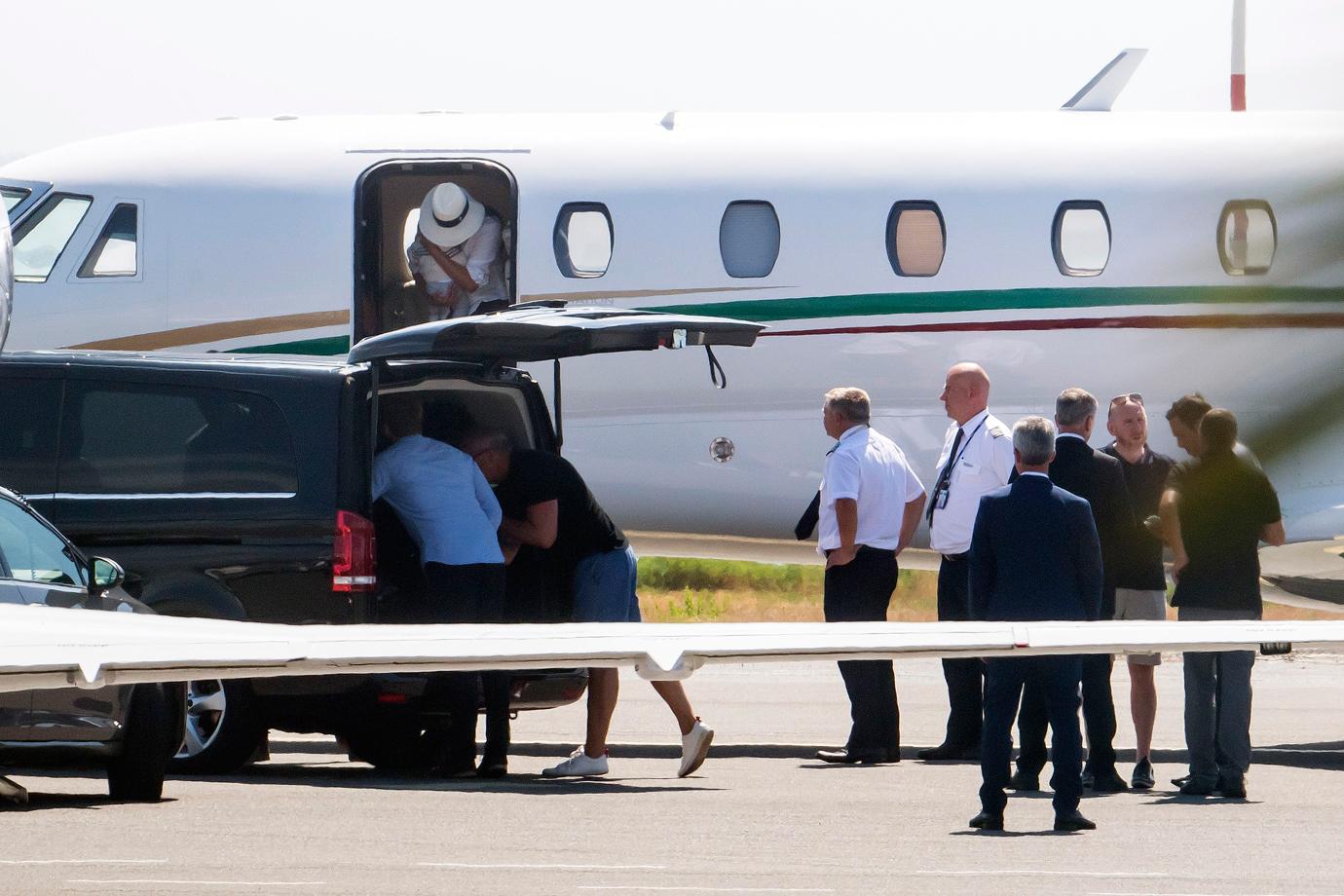 Meghan Markle cradles baby son Archie in both arms as she leaves the luxury private jet