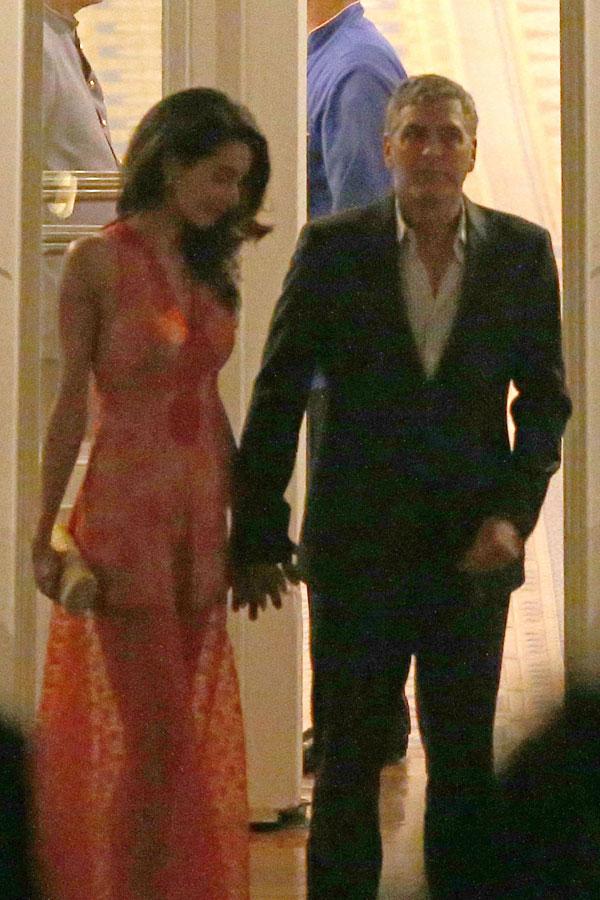 //george clooney amal clooney dinner italy kiss hold hands