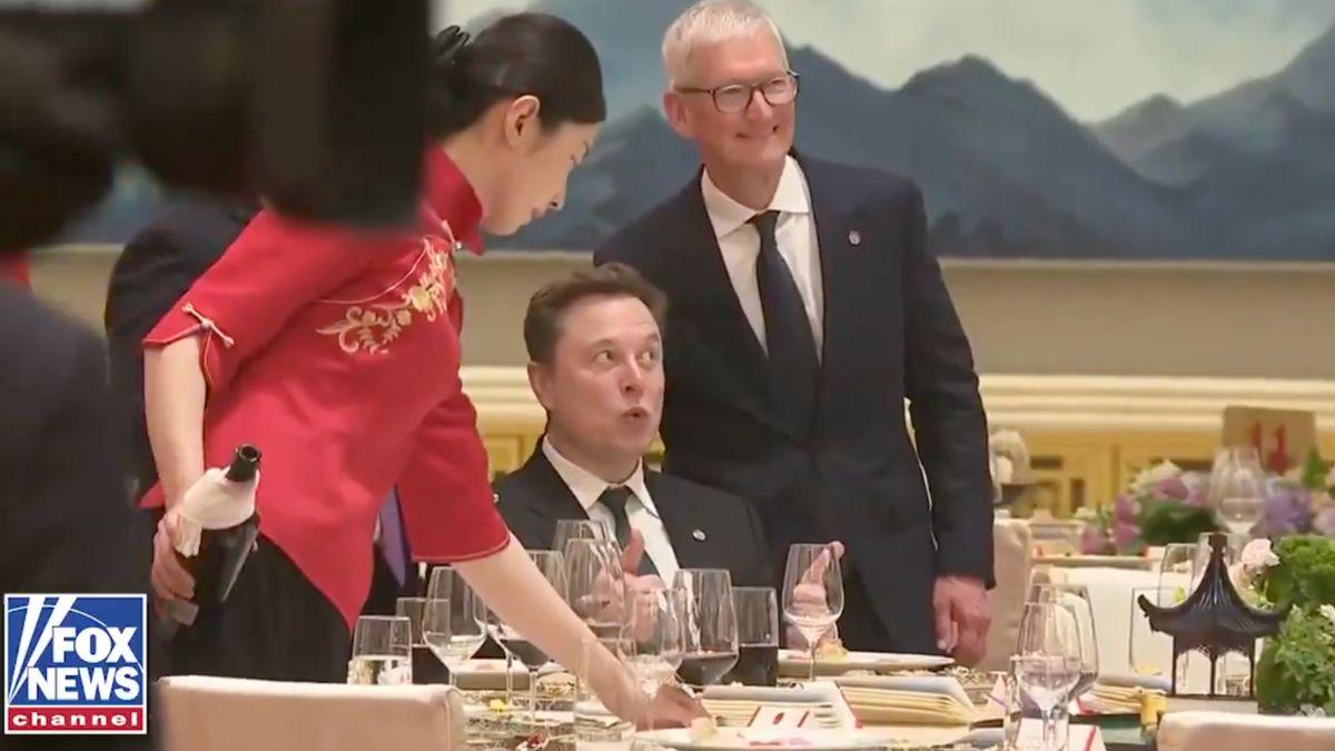 Photo of Elon Musk, Tim Cook
