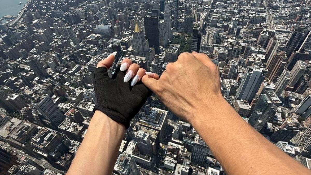 The couple celebrated their love, before climbing down and being taken away by cops.