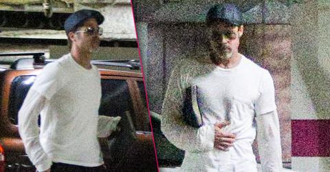 //brad pitt grabs stomach before meeting pp