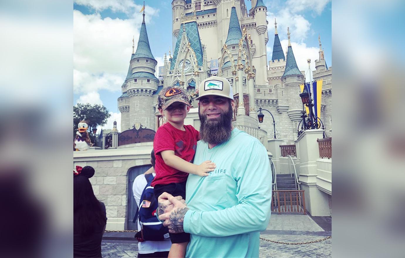 David Eason holding Kaden at Disney World.