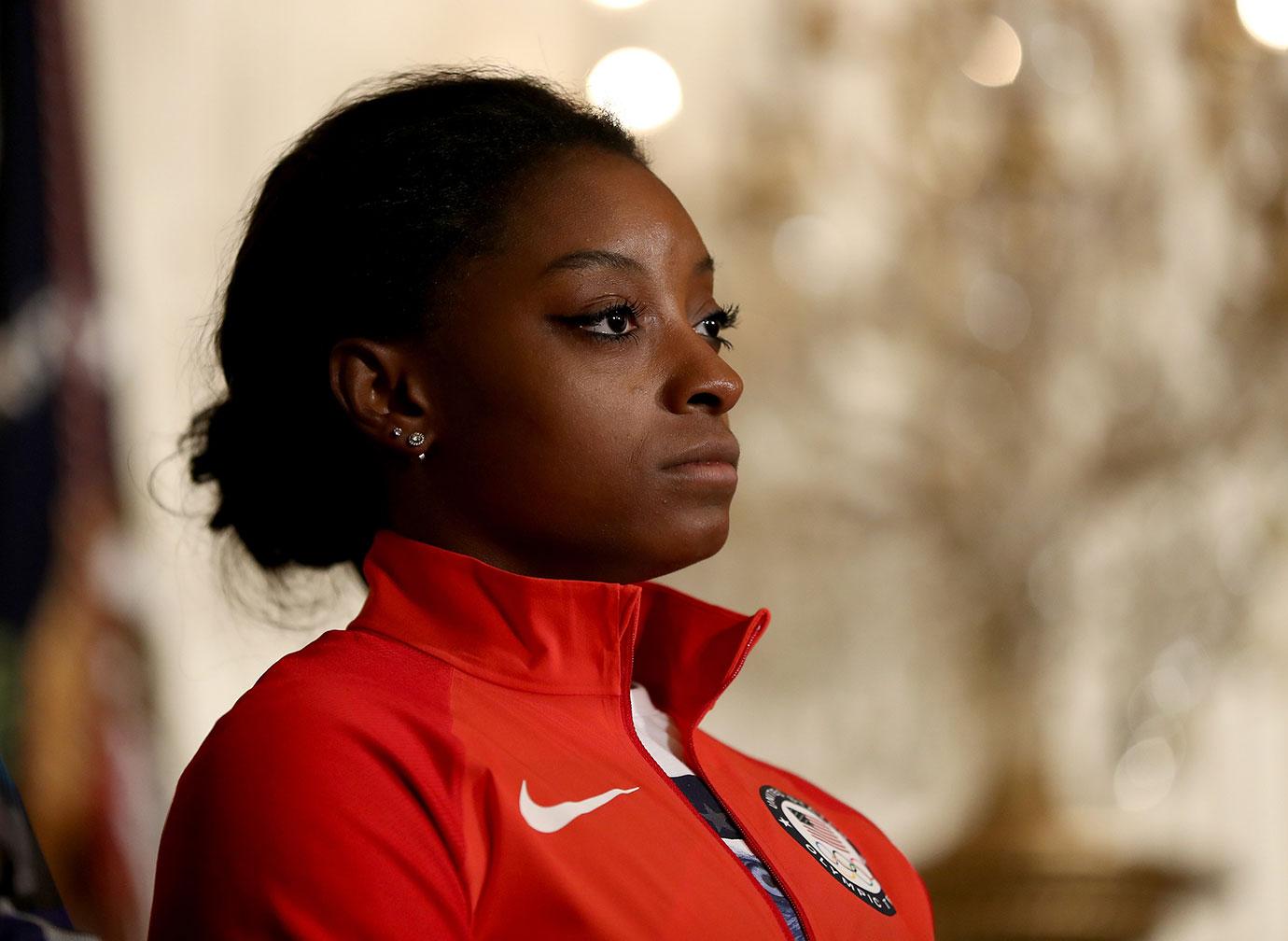 simone biles troubled childhood dad evicted sister car accident dwts