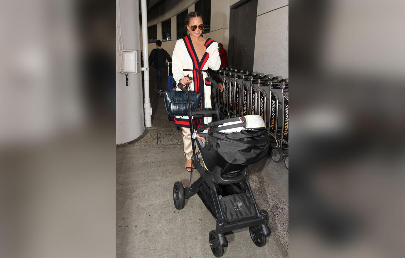 //chrissy teigen nip slip robe airport