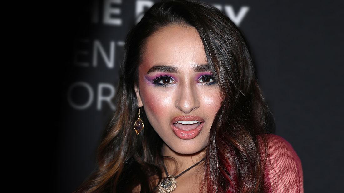 Jazz Jennings Whearing Purple Dress Looking At Camera