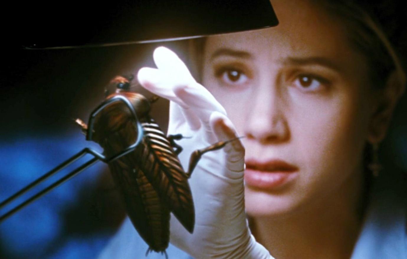 Mira Sorvino looked at a cockroach unlike she’s ever seen before in the horror film Mimic.