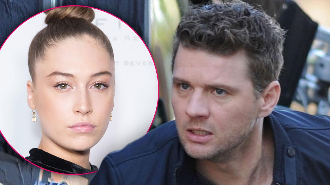 On Left, Inset Photo of Elsie Hewitt with Hair In A Bun, On Right, Ryan Phillippe on Set Looking Angry