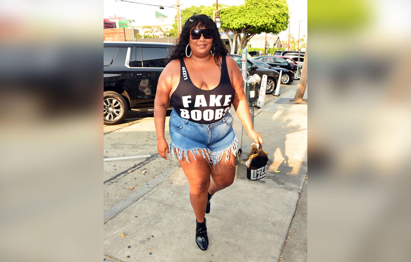 lizzo craigs fake boobs top jean shorts