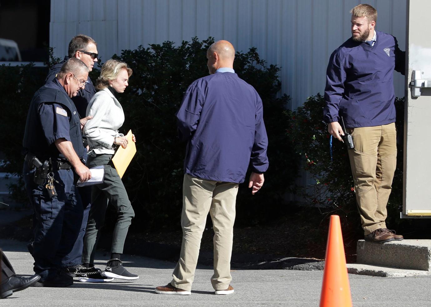 Michelle Carter, center, arrives for a parole hearing on in Natick, Mass.