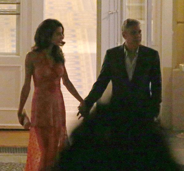 //george clooney amal clooney dinner italy kiss hold hands