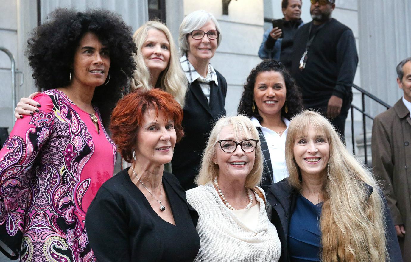 The women accusing Cosby pose for a photograph.