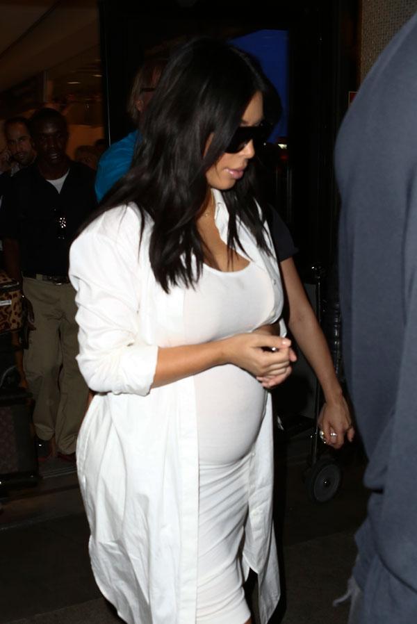 Kim Kardashian Flaunts Baby Bump In White Dress