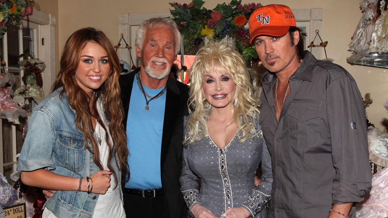 Image Of Miley Cyrus (right) and late Dolly Parton (centre-left)