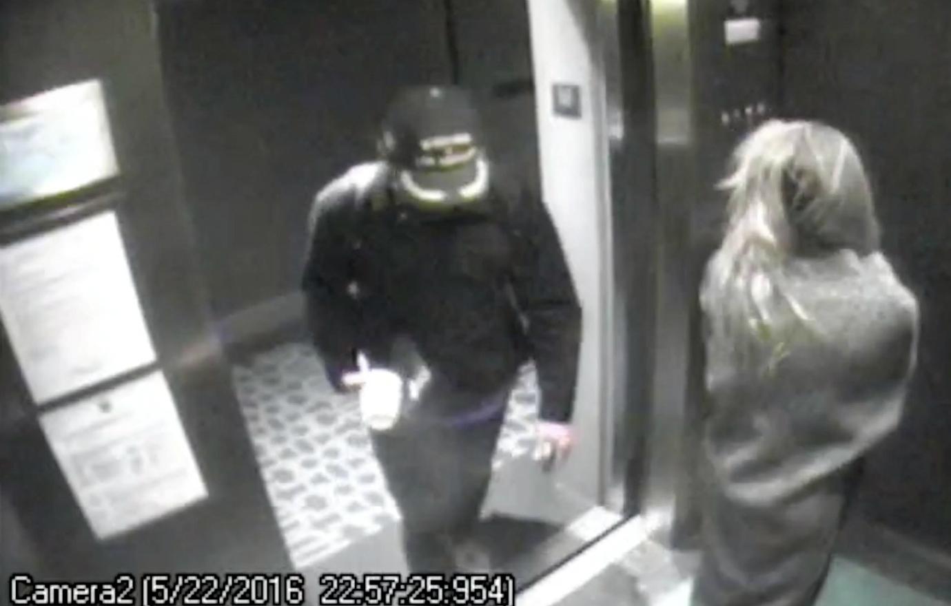 In a black and white screencap, James Franco was seen on a surveillance video, as he entered an elevator with Amber Heard. Franco wore a hat that covered his face while Heard was seen from behind.