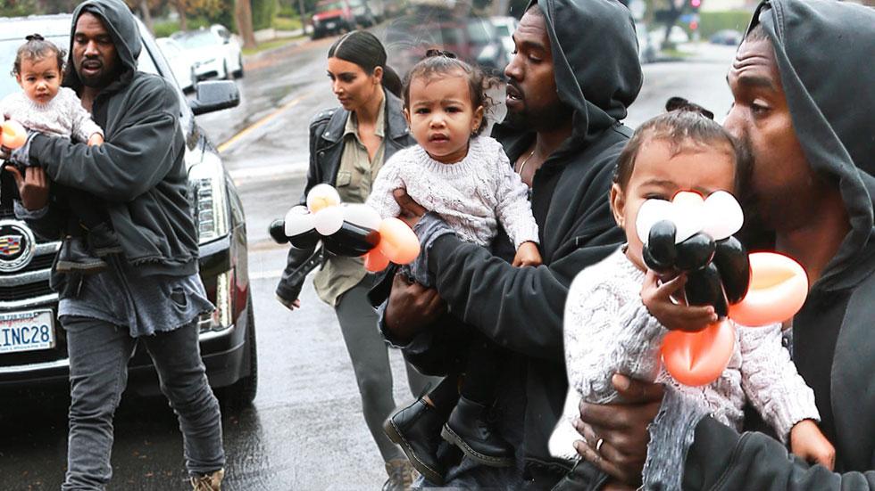 Kanye Kisses North West