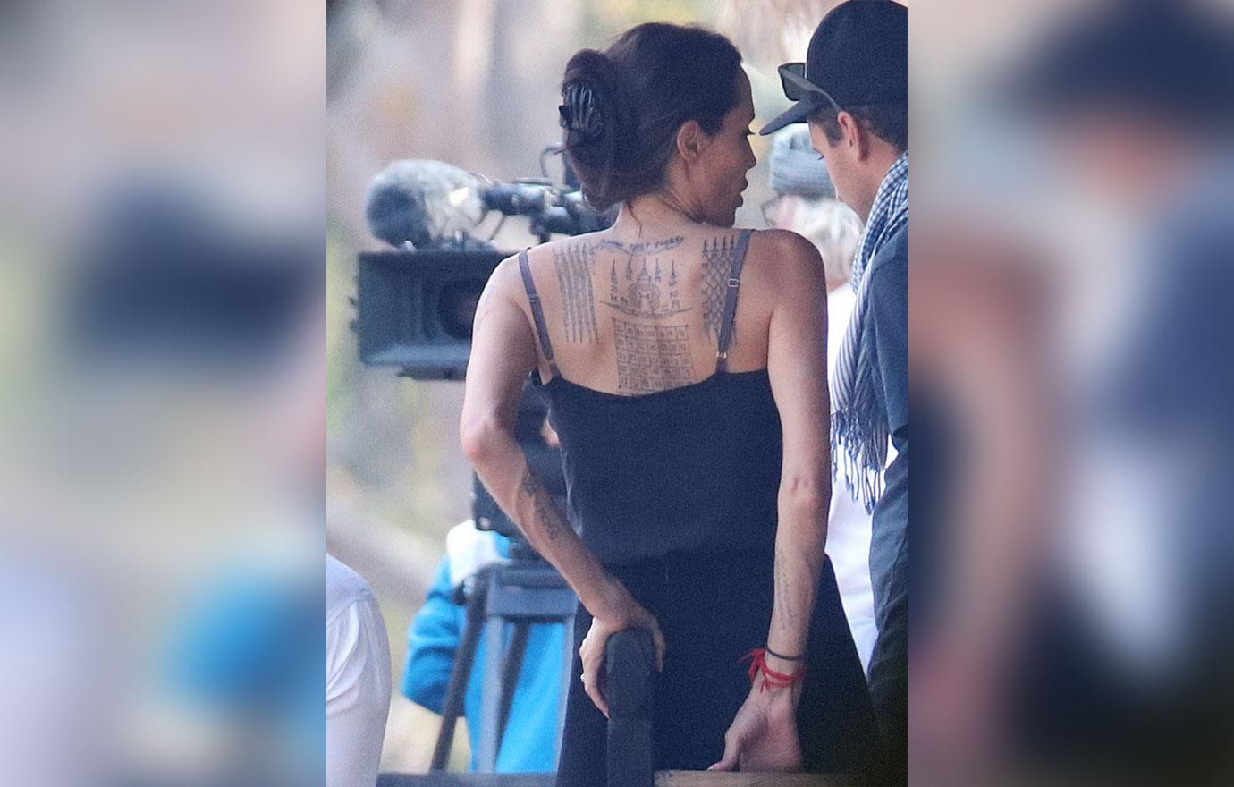 //Angelina Jolie Brad Pitt Divorce Feud Tattoo