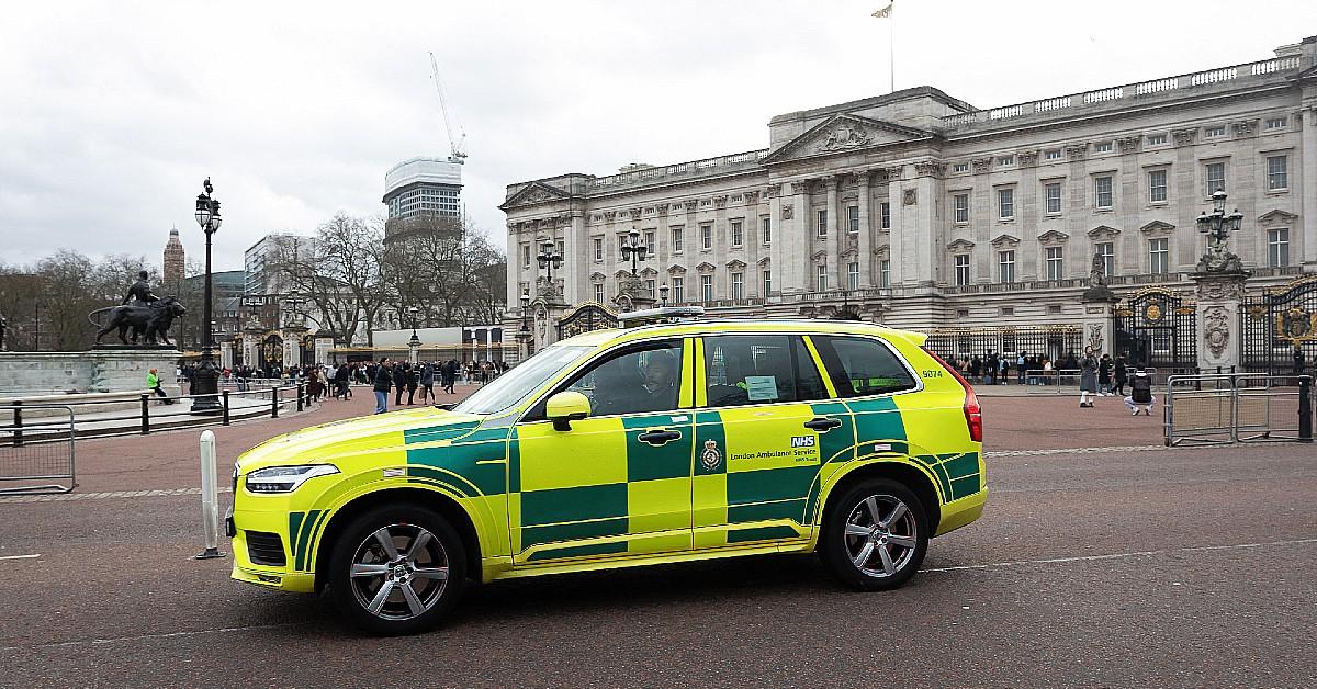 Composite picture of police car outside of Buckingham Palace