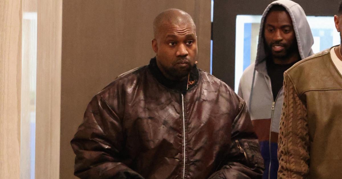 Kanye West snatches phone after pap asks about 'controlling
