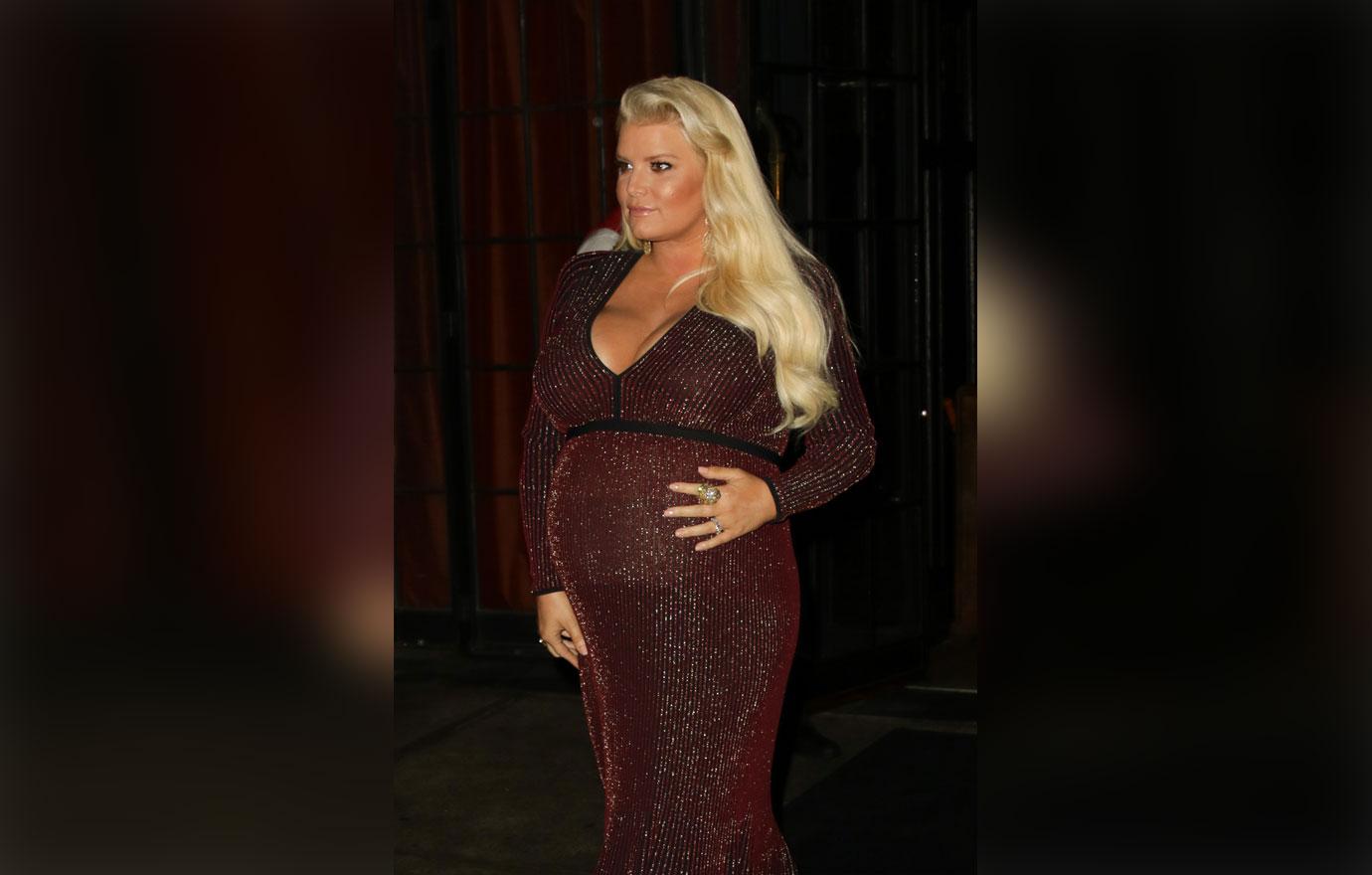 Pregnant Jessica Simpson busts out in clinging black gown at a wedding