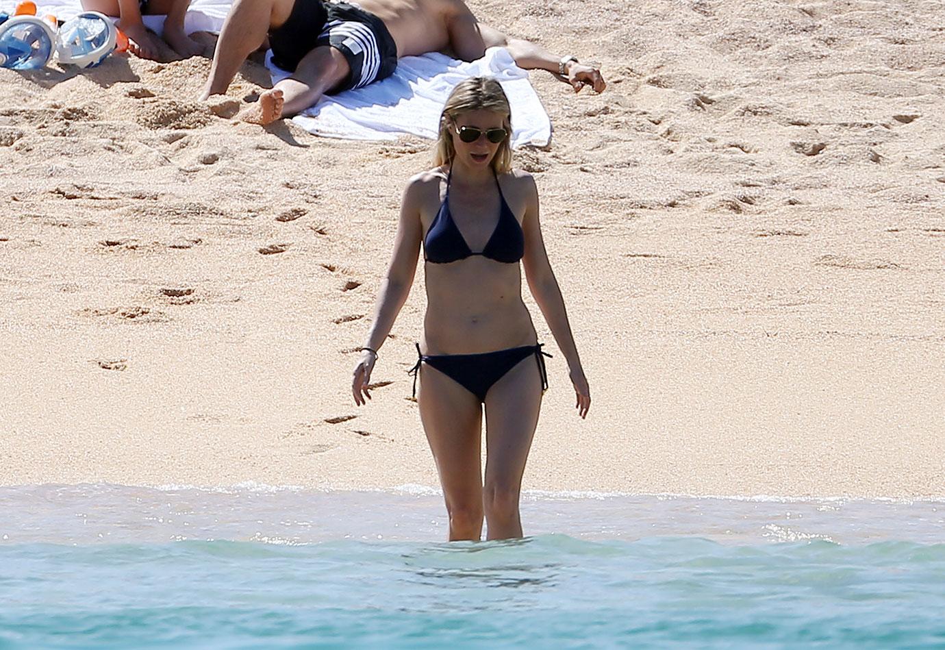Gwyneth Paltrow splashes around in bikini on the beach