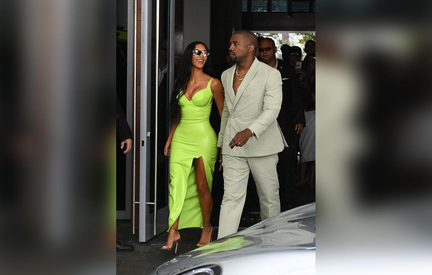 Kanye West carries Kim Kardashian out of their G Wagon and grabs her butts  as they arrive at 2 Chainz's wedding in Miami (Photos)