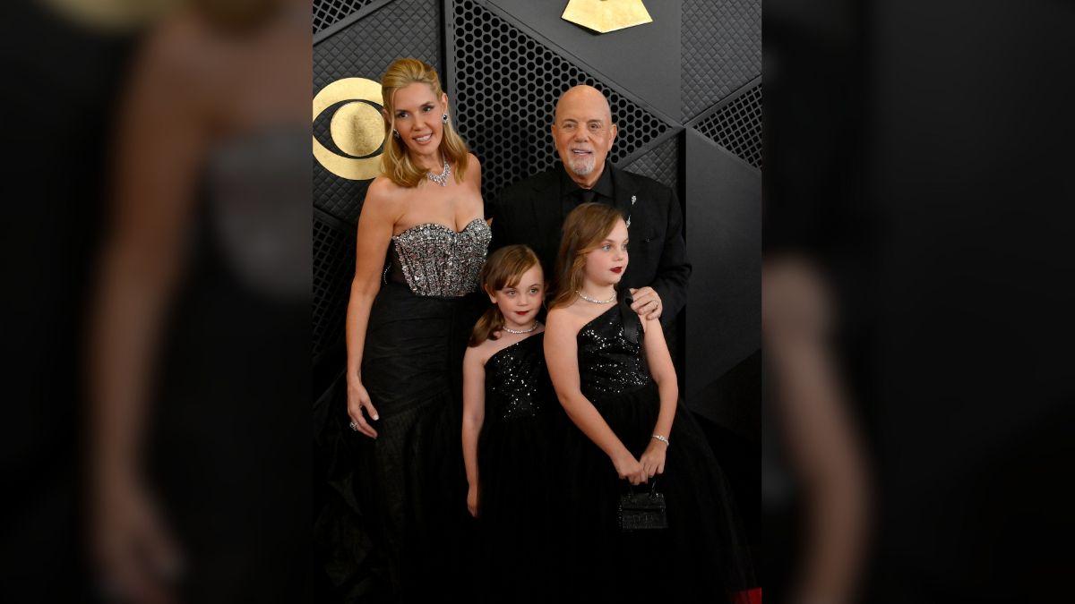 Alexis Roderick and daughters Della and Remy watched as Joel joined tribute band Turnstiles to play 'We Didn't Start the Fire' and 'Big Shot.'