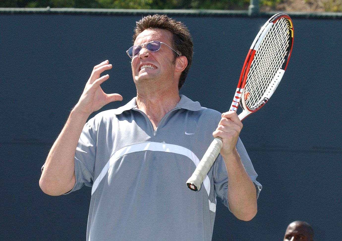 Matthew Perry demonstrates his tennis skill on the court.