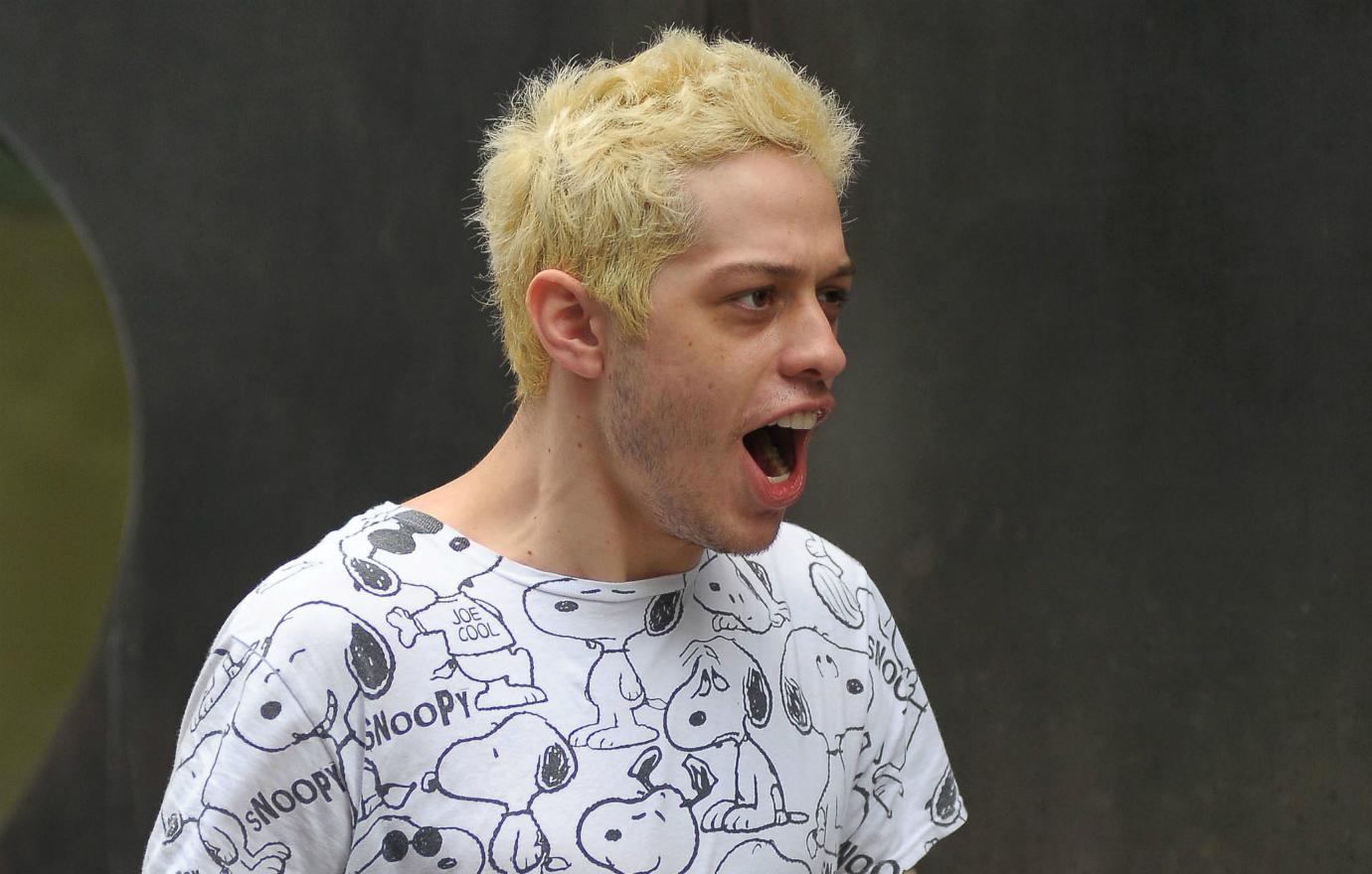 Pete Davidson is spotted out with his lady lover and seems less than happy about it.