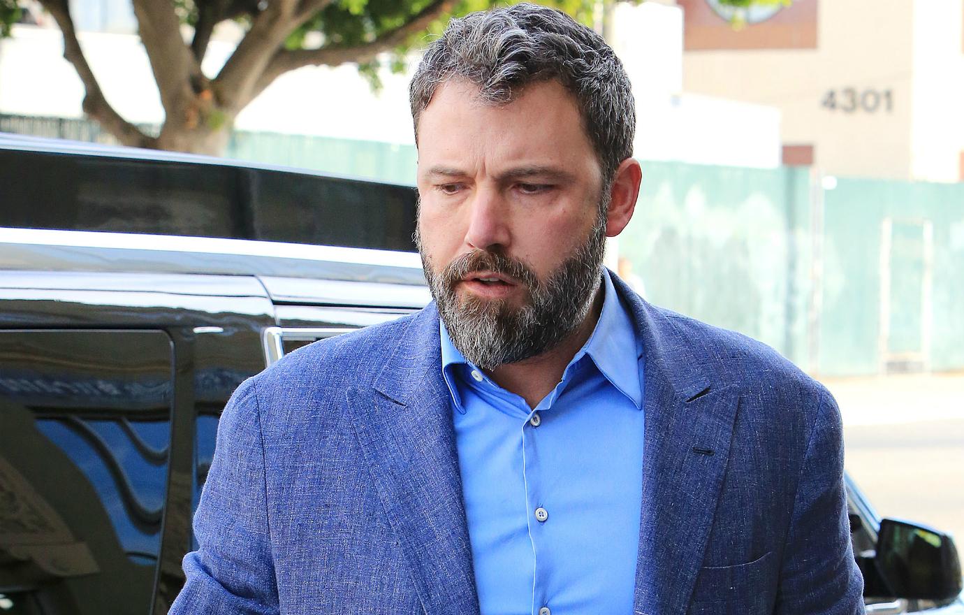 Ben Affleck walked the streets of LA in a darker blue blazer with a lighter blue shirt and tan pants.