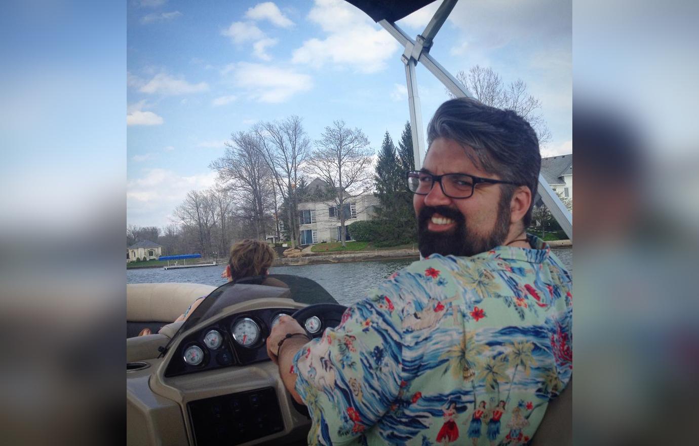 Andrew Glennon Smiles For Selfie While Steering Boat