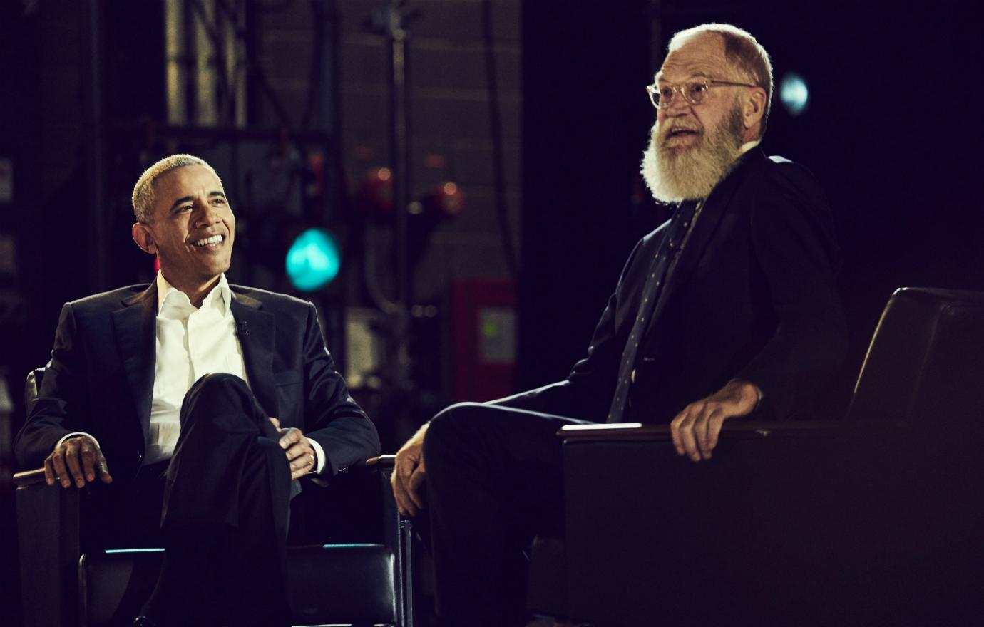 David Letterman wore a black suit with a navy tie and sat across from President Obama in a black suit with a white shirt and no tie in a scene from Letterman’s Netflix talker.