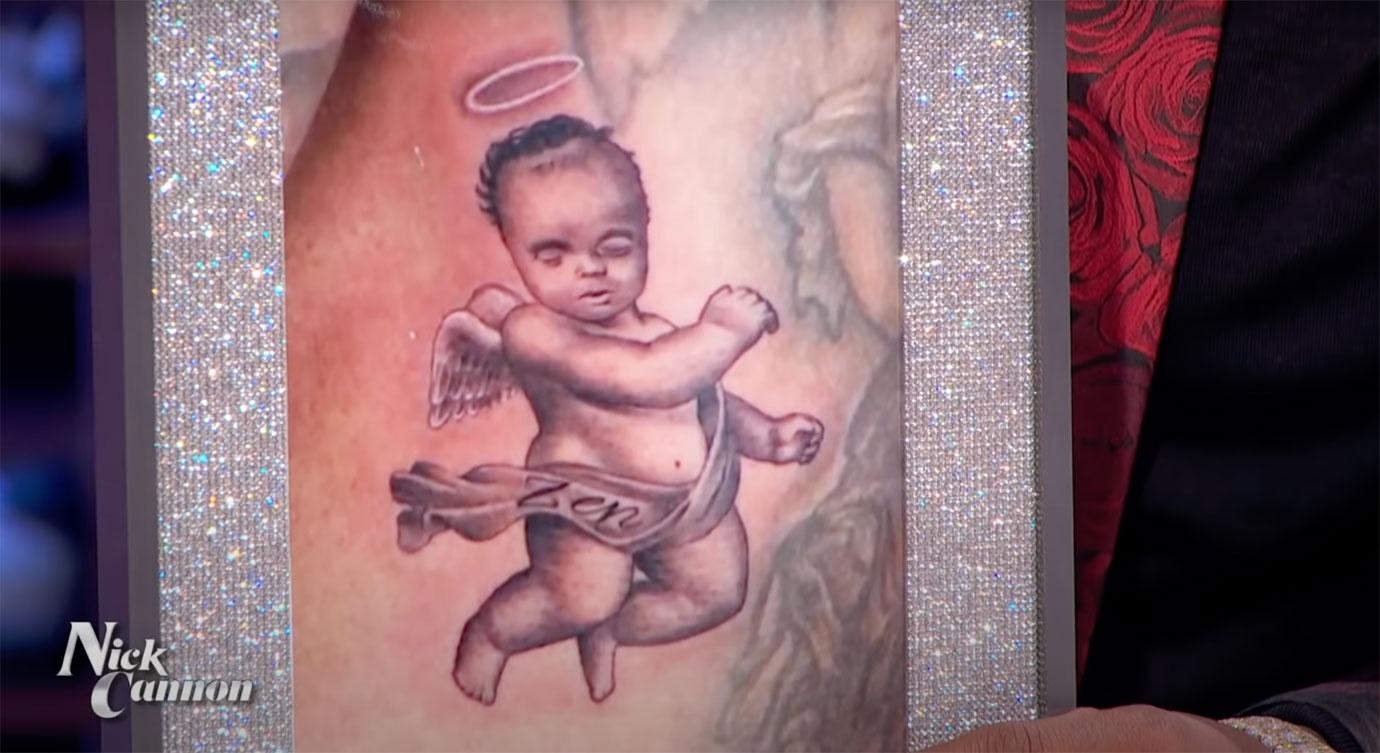 nick cannon new tattoo late son zen angel ribcage