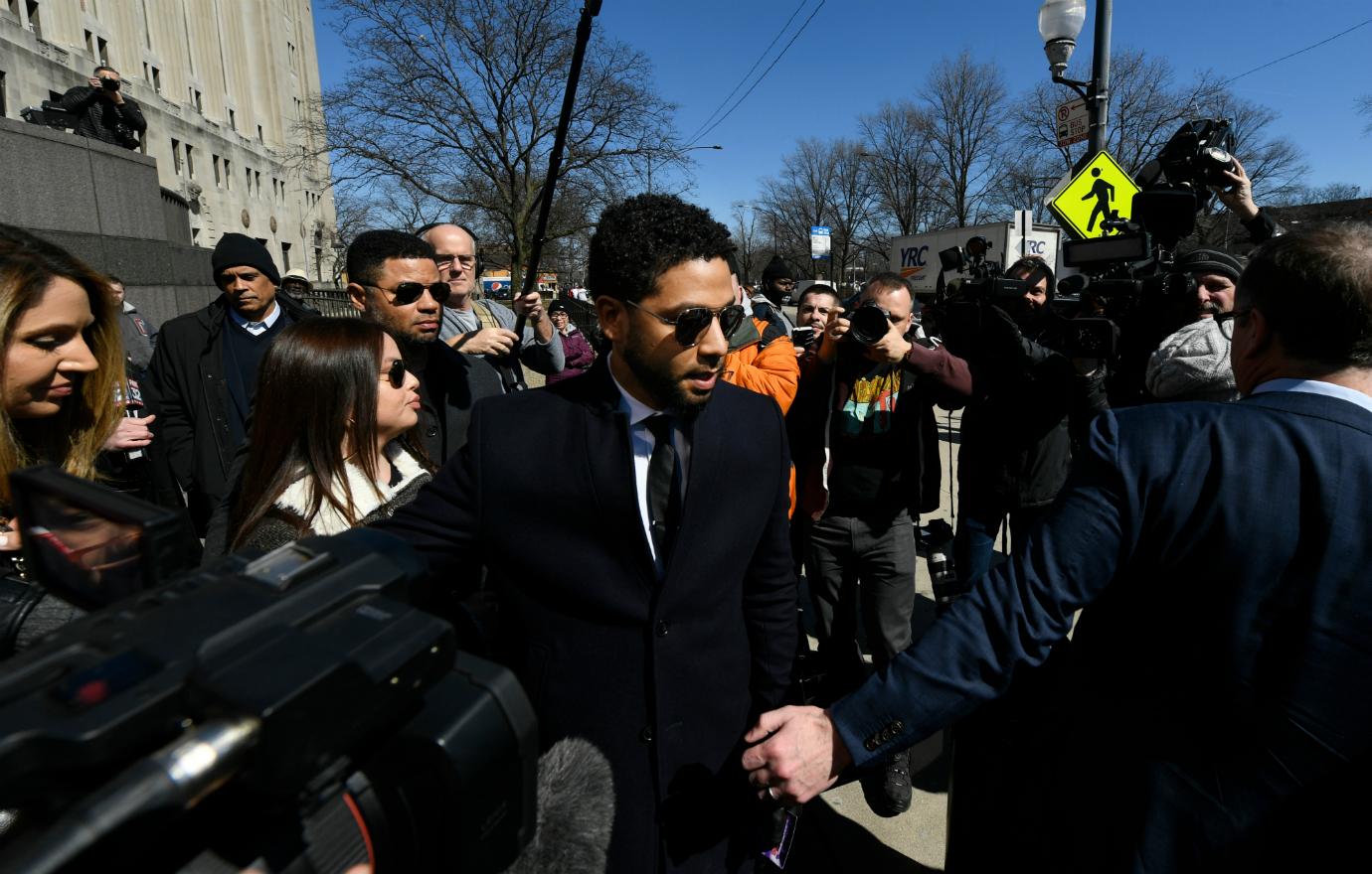 Jussie Smollett wore a white dress shirt, black tie and black blazer at the Cook County Courthouse.