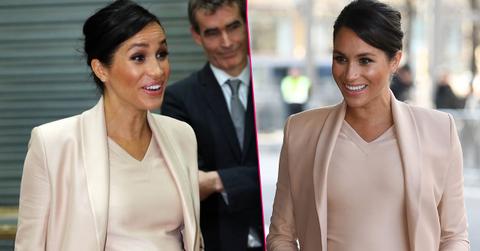 Pregnant Meghan Markle Cradles Stomach During Visit To Royal Theatre