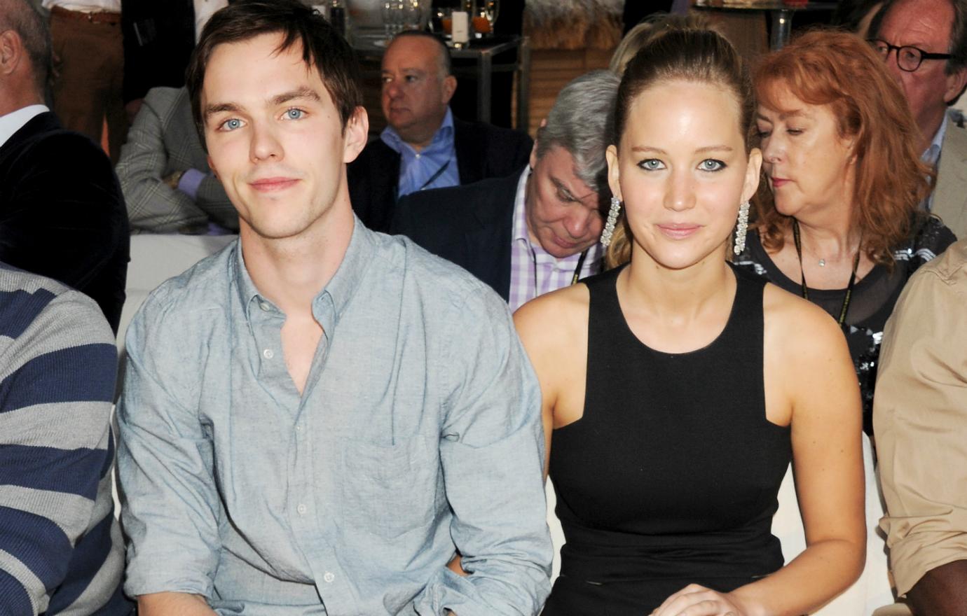 Jennifer Lawrence and Nicholas Hoult attended a fashion event, he in a polo shirt and slacks and she in a black dress with a leg slit.