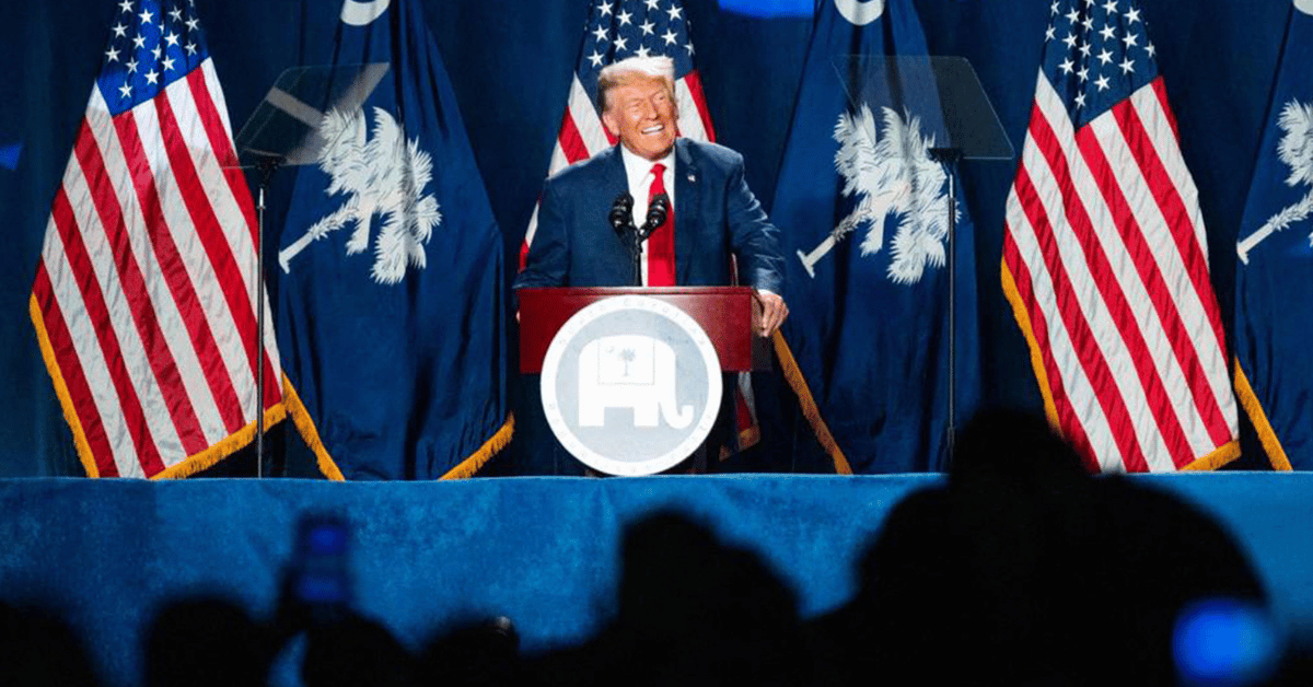 donald trump campaigning from behind the defendants table