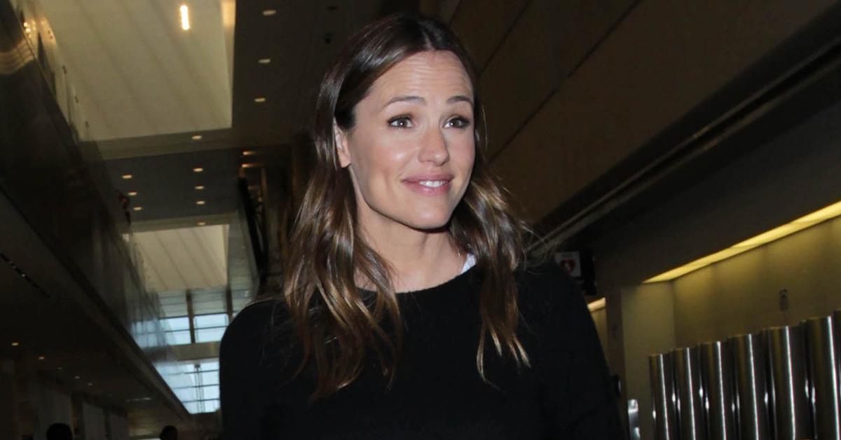 jen garner john miller fiance rare appearance airport photos