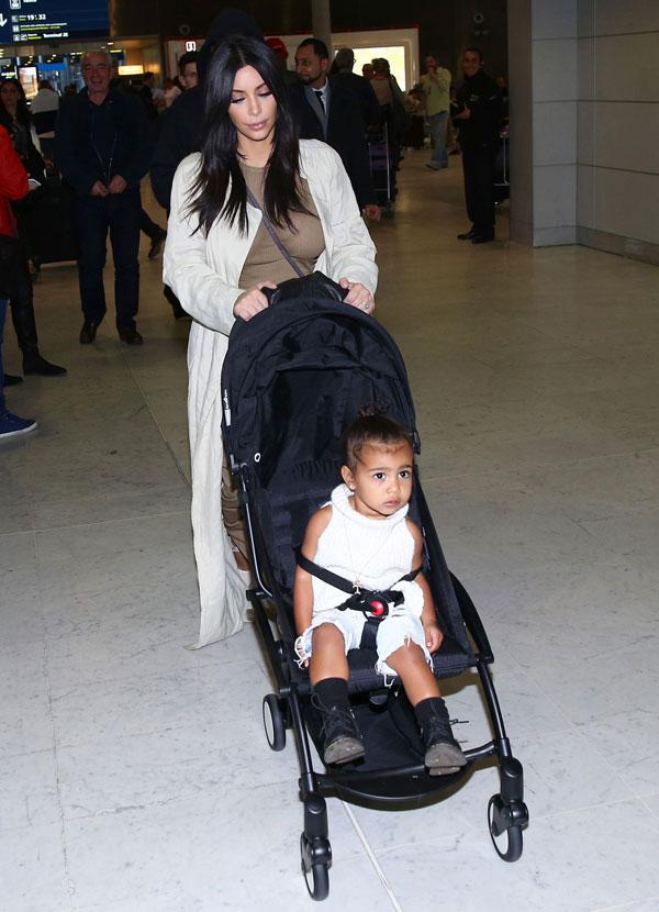 Kim Kardashian Kanye North West Photos -- Toddler Smiles As Family Arrives In Paris