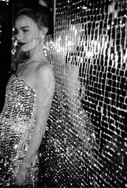 Kate Bosworth looking glamorous as she leans against a sparkly wall in her shiny Swarovski crystal decorated Fendi dress at an event in a new pic she shared. She says