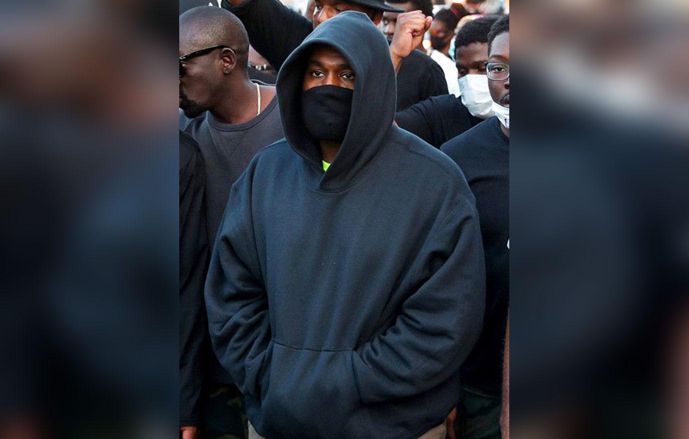 kanye west hides paparazzi mask berlin cheated kim kardashian first photos