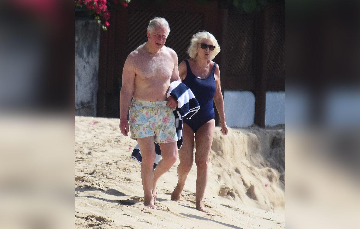 //Prince Charles Blossoms On Beach In Floral Trunks_