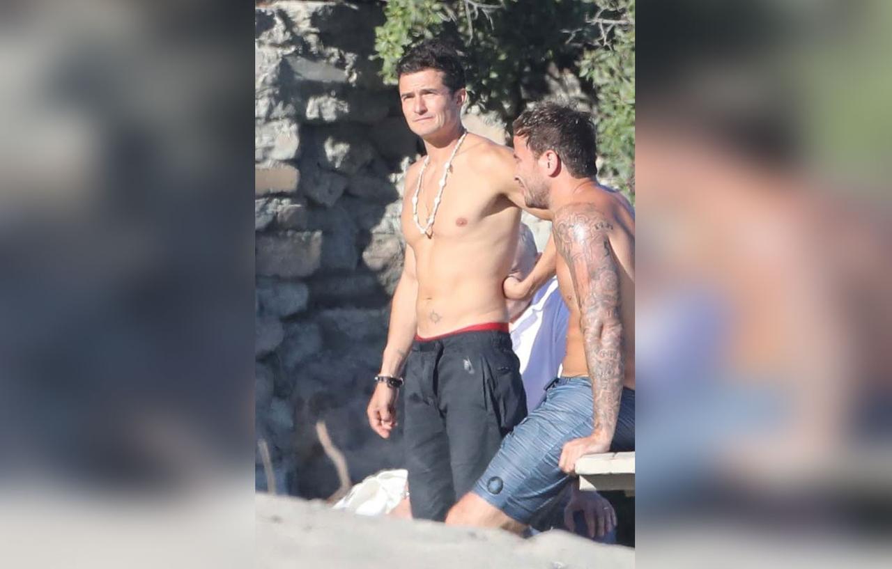 Orlando Bloom Goes Shirtless While in Malibu With Dad & Son