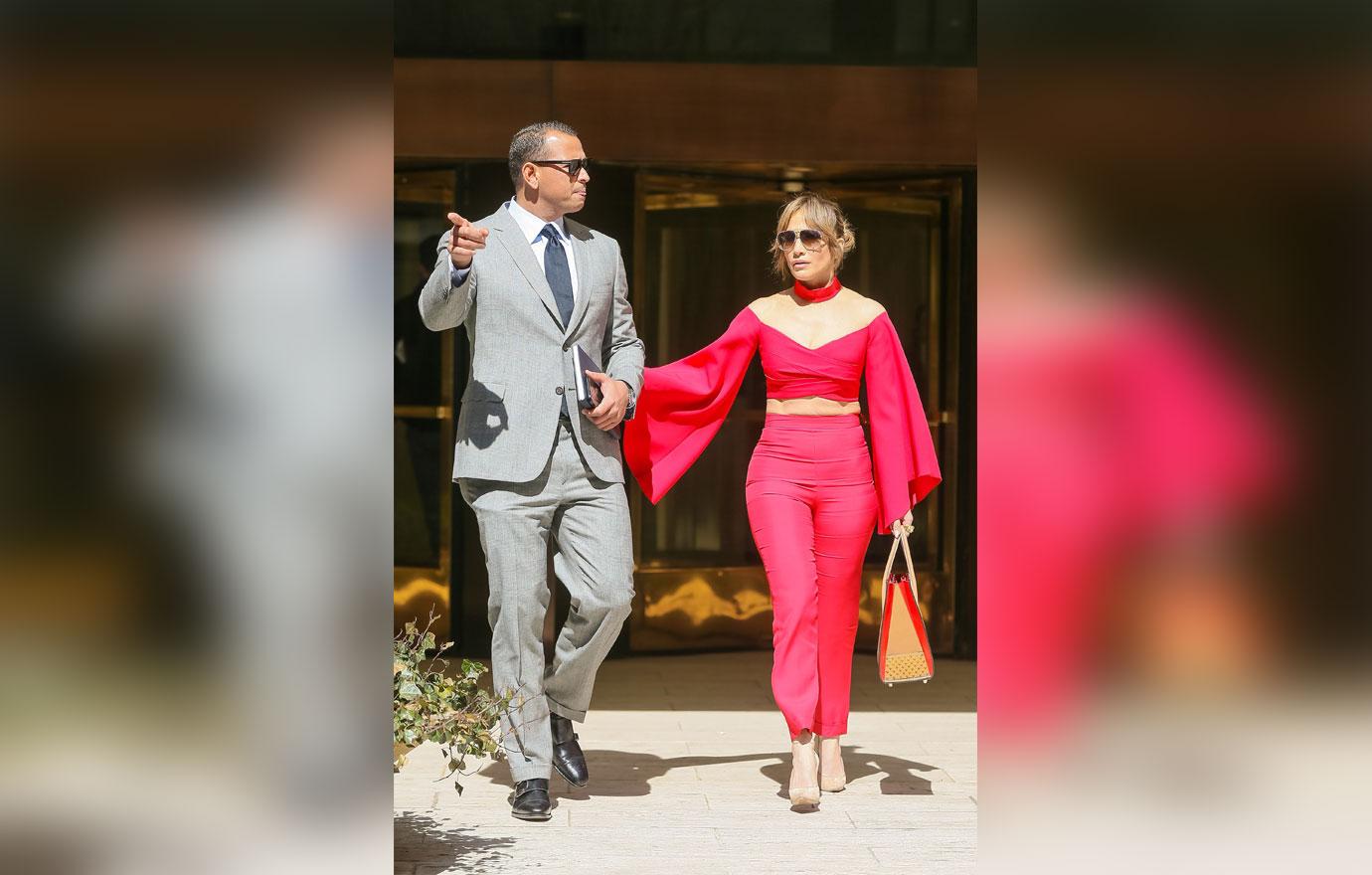 //jennifer lopez alex rodriguez holding arms red shirt boobs pants