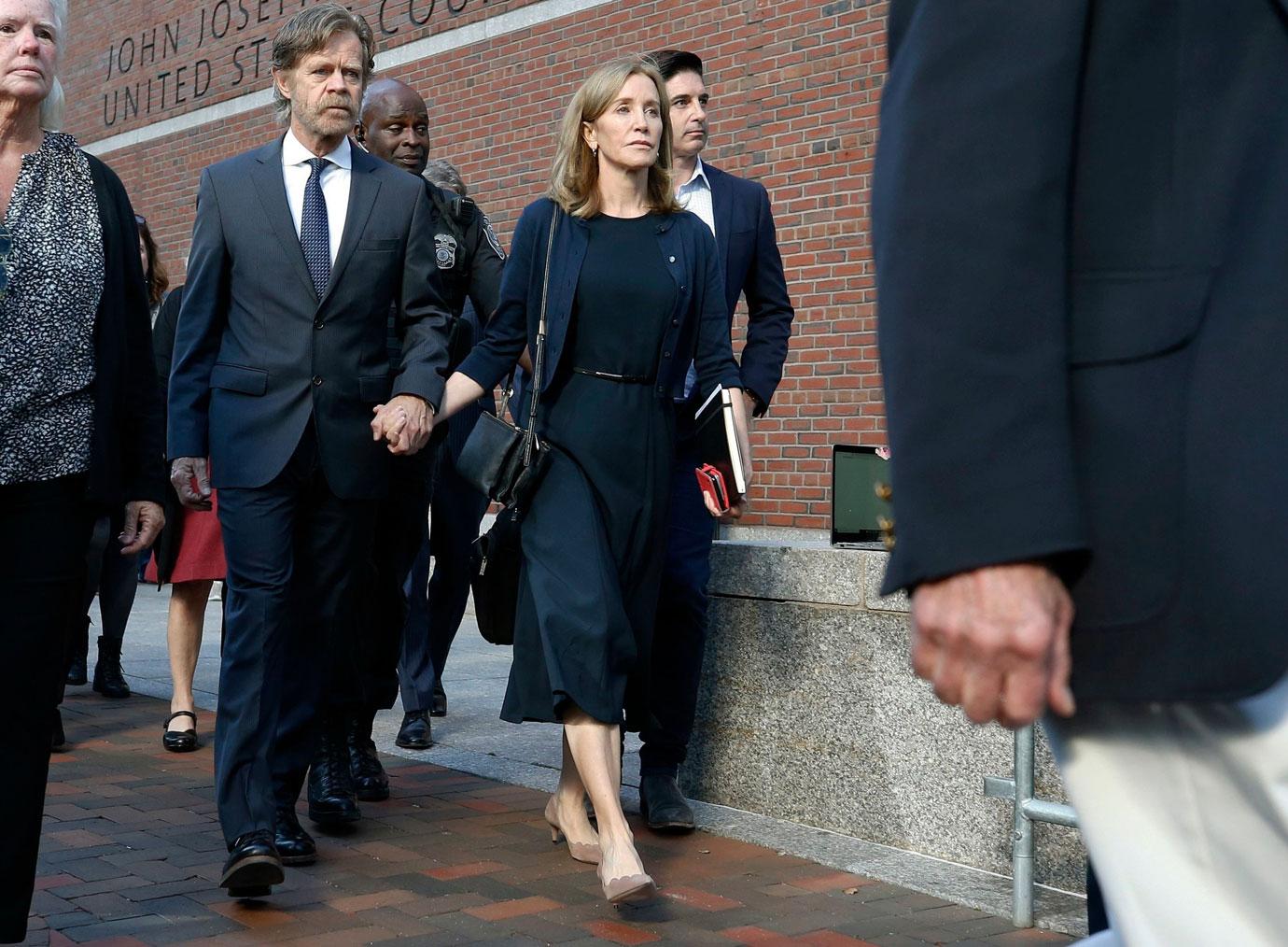 Felicity Huffman leaves federal court with her husband William H. Macy after she was sentenced in a nationwide college admissions bribery scandal, in Boston