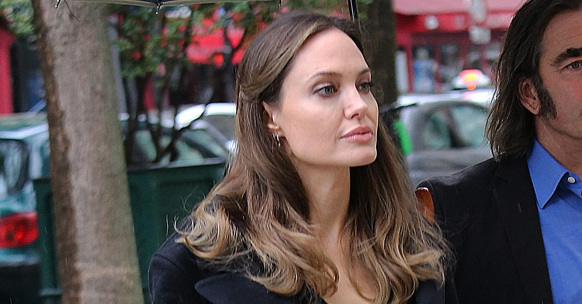 Angelina Jolie Steps Out In Long Black Coat And Sunglasses Amid